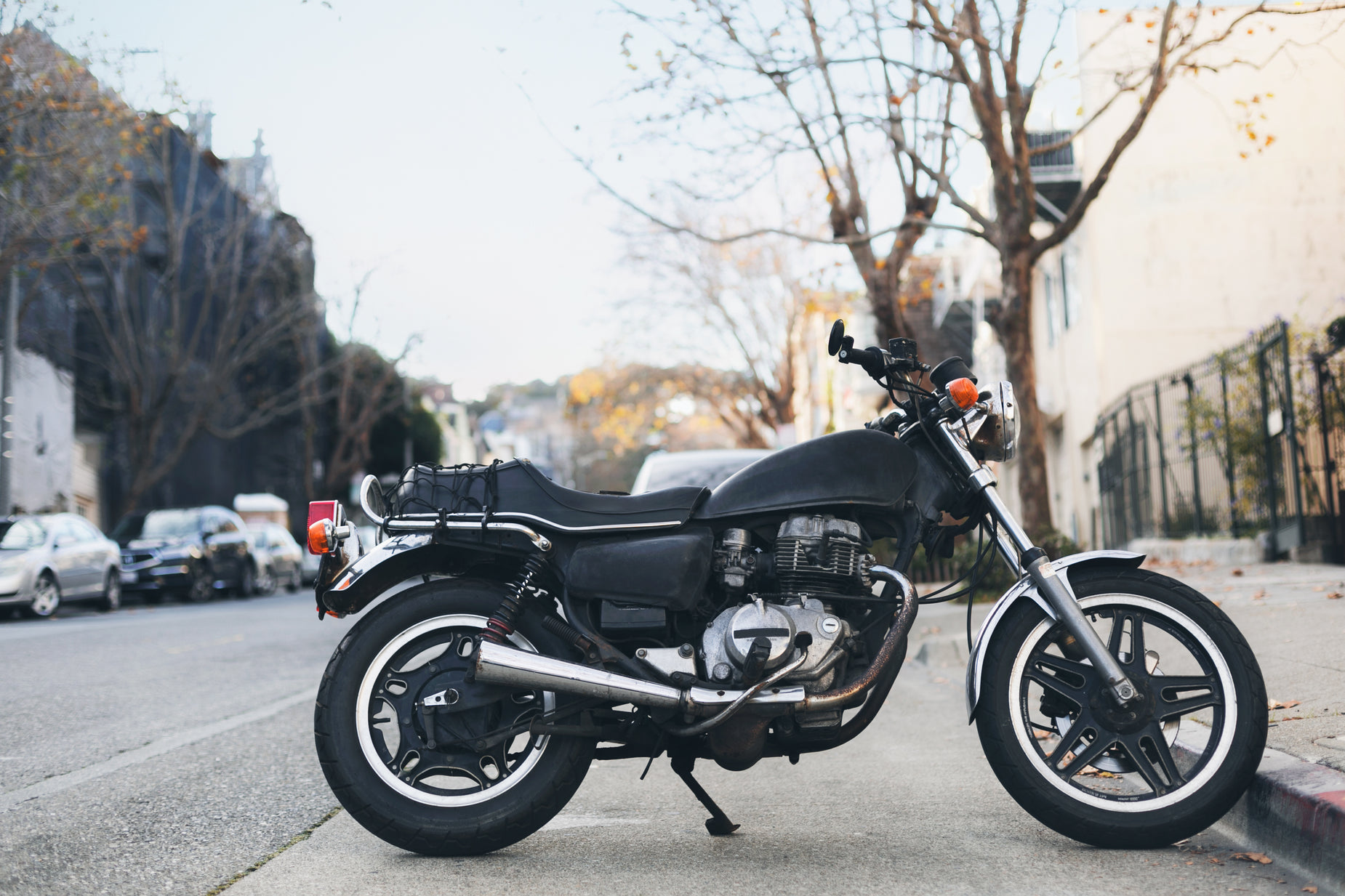 a motorcycle parked on the side of a road