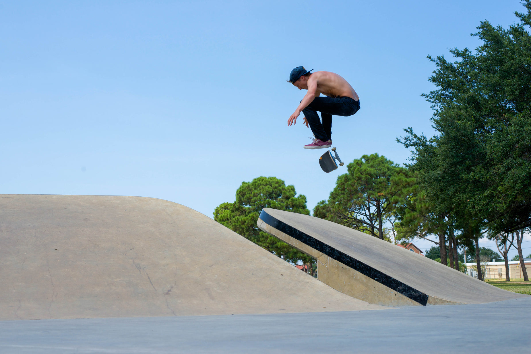 a man is jumping in the air while skateboarding