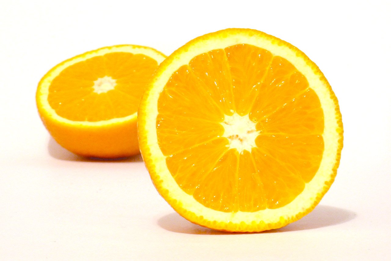 a piece of orange that is cut in half