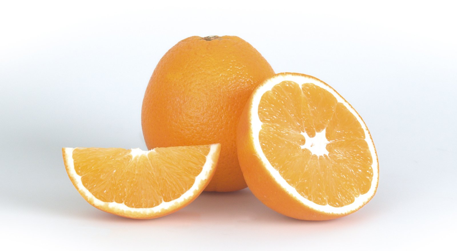 three halves of oranges stacked on top of each other