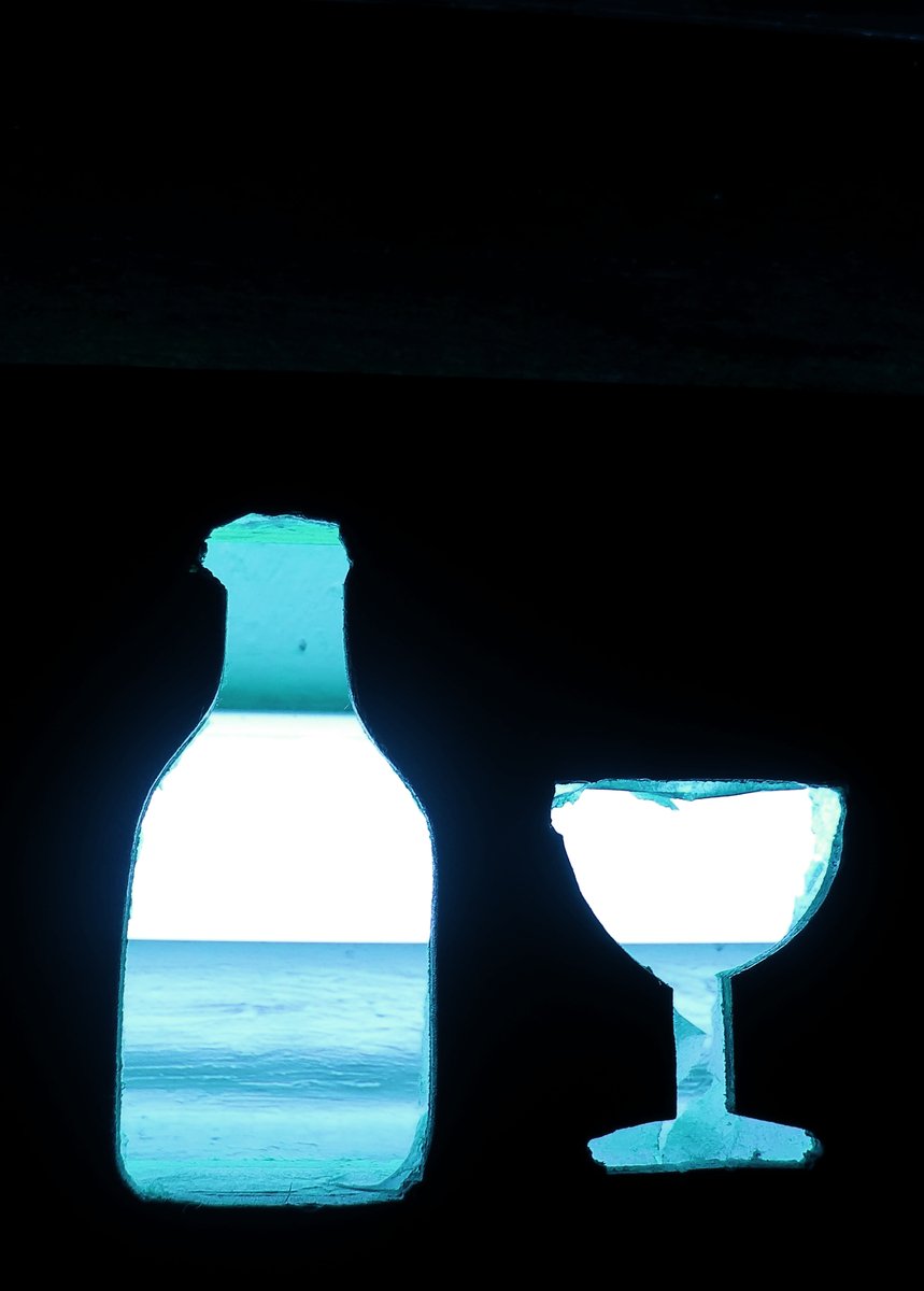 an up close image of two bottles in a room