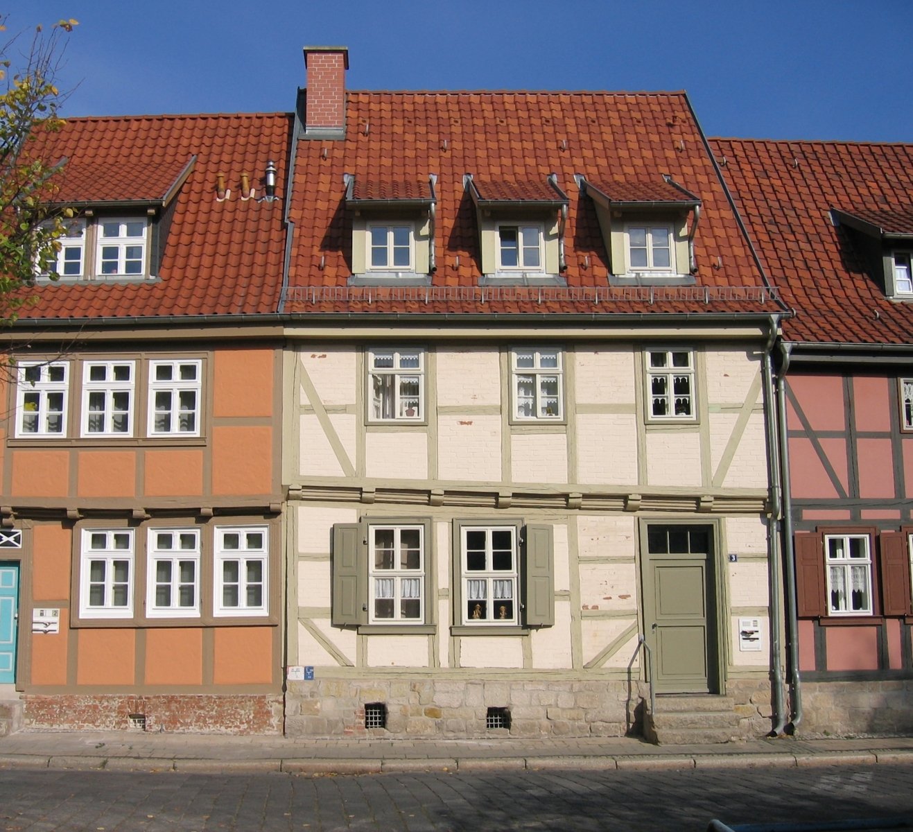 old buildings are painted with different colors