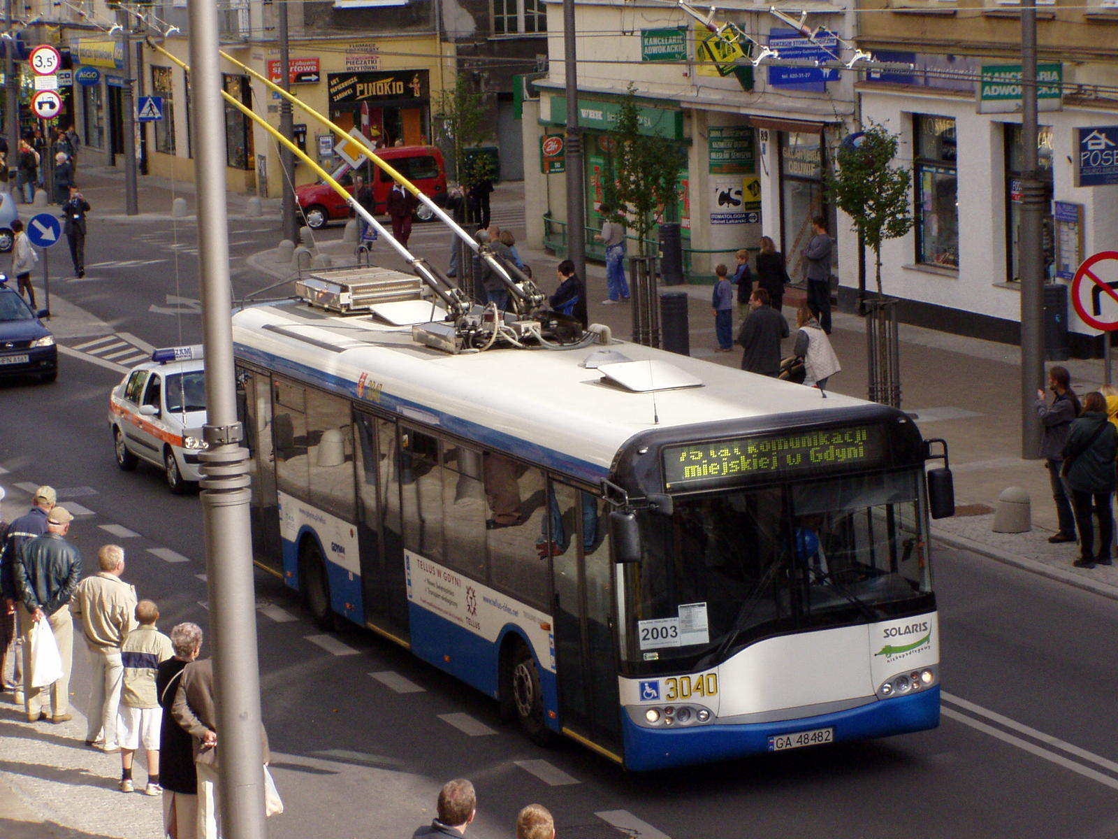 a bus driving down a street filled with traffic