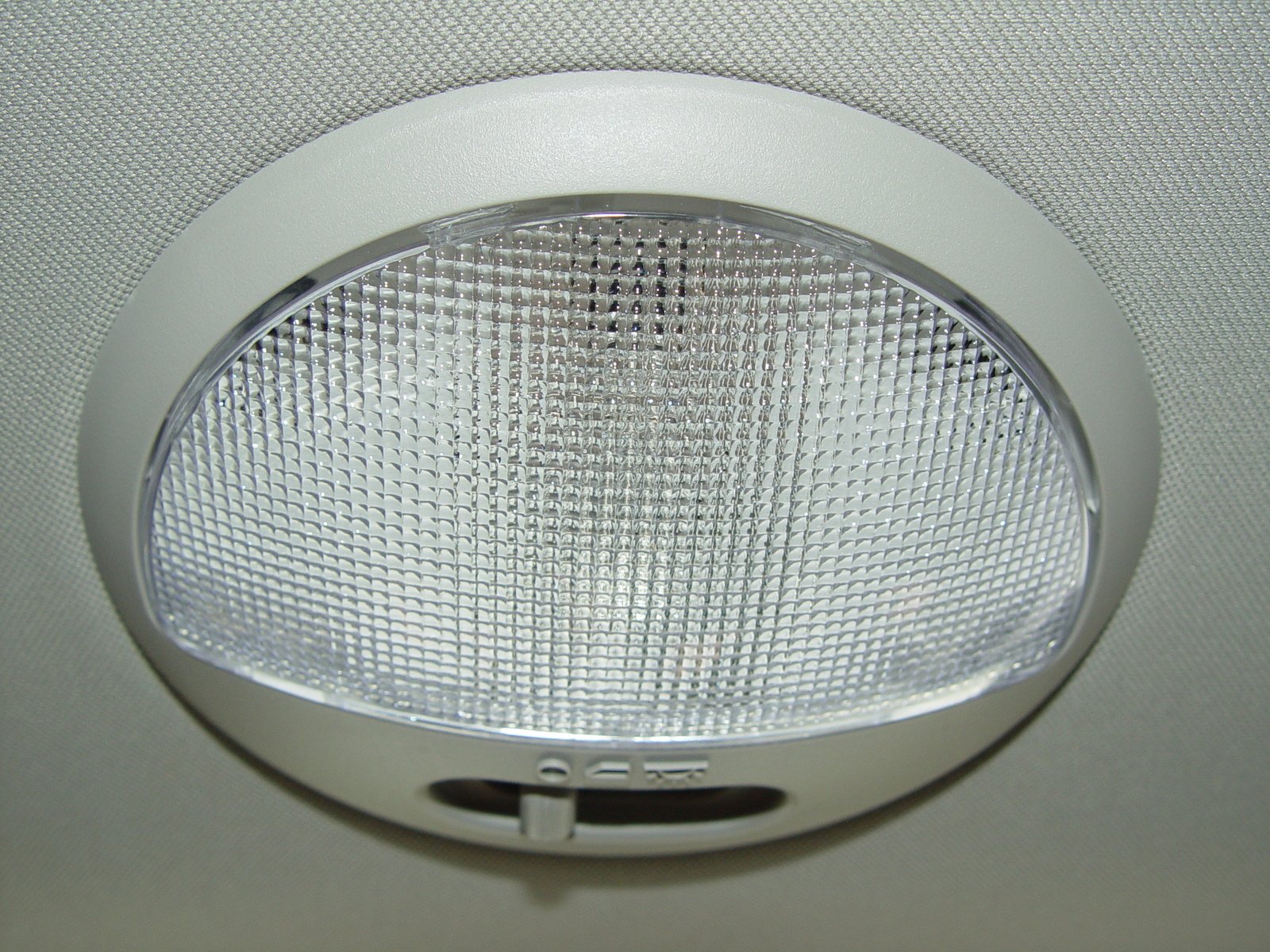 a chrome finish light on an air conditioner