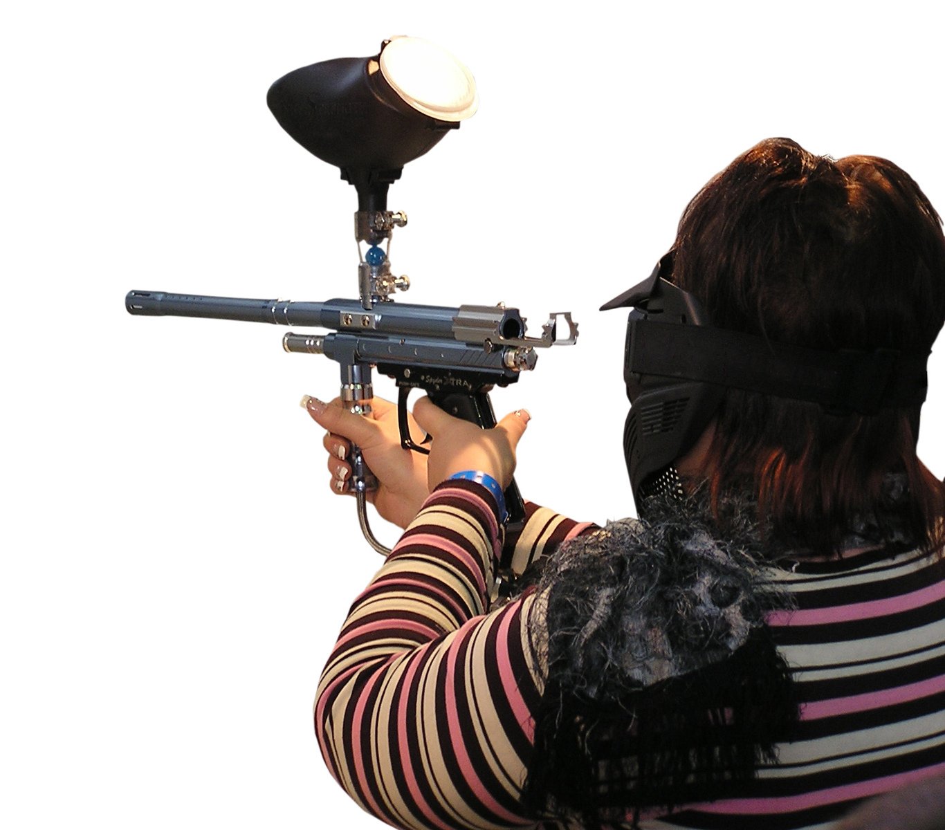 a woman is holding an air rifle with one hand on her shoulder