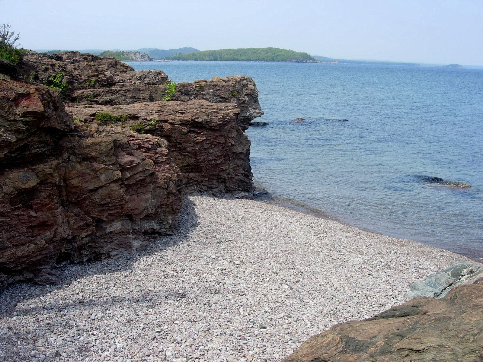 the rocks are on both sides of the water