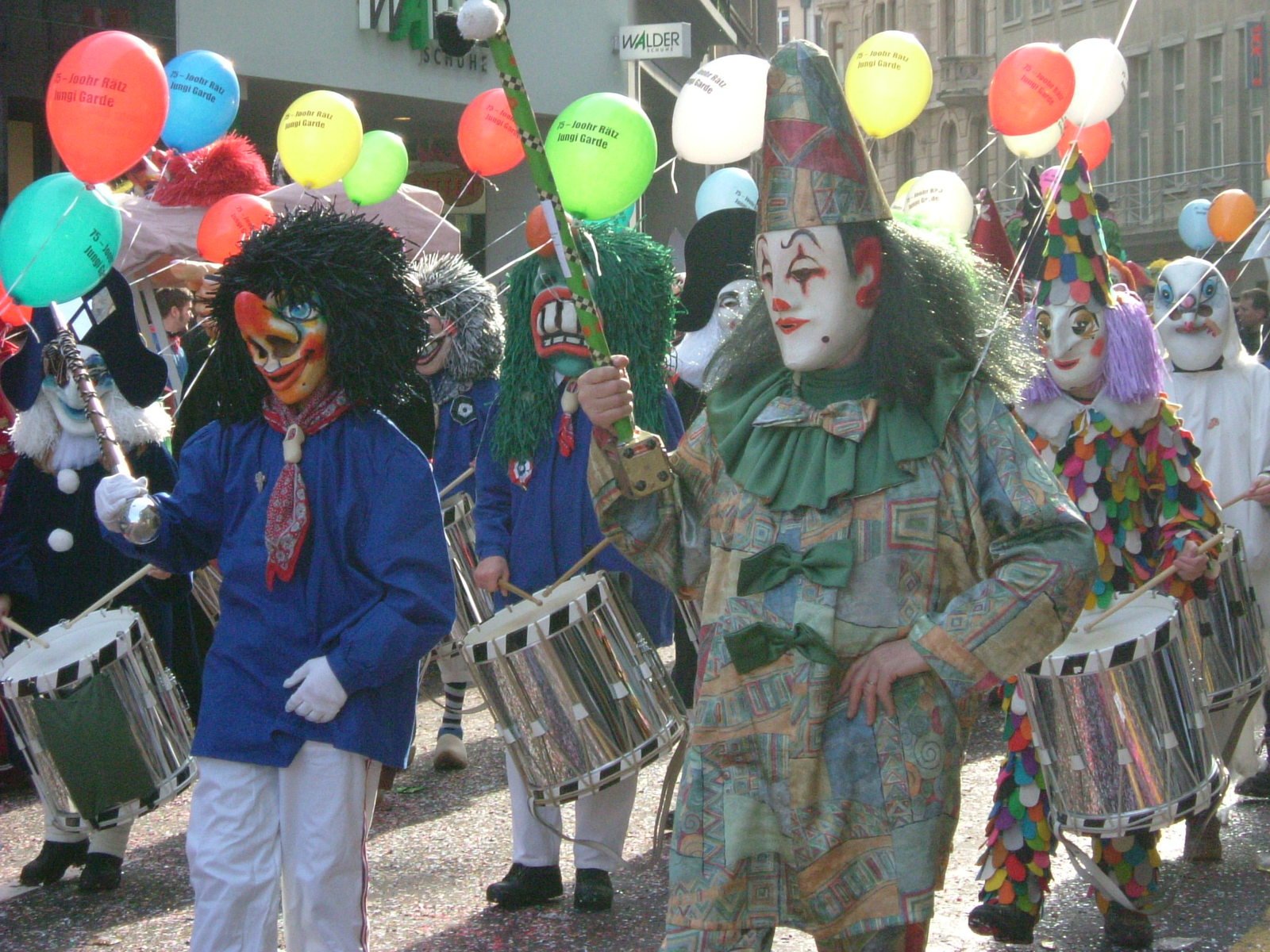 a parade is being held in front of a building