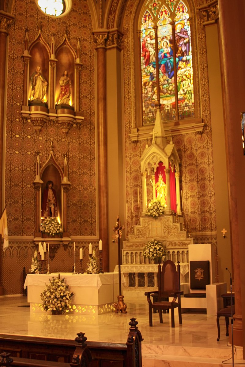 a cathedral with gold decorated walls and windows