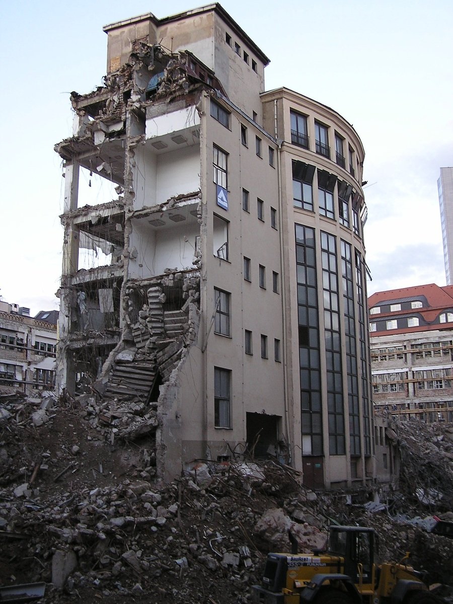 a very old looking building that has stairs going up to it