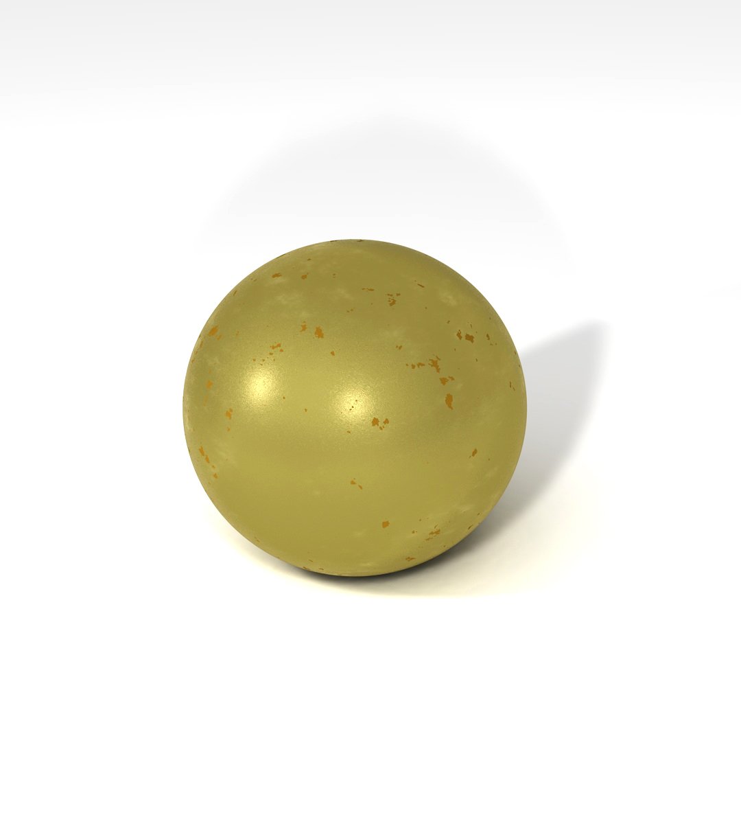 a round yellow object on a white surface