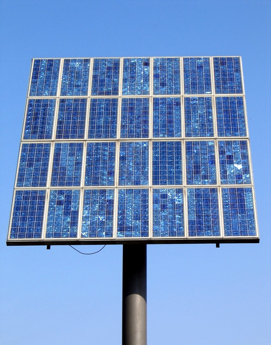 a solar powered lamppost on a clear blue day