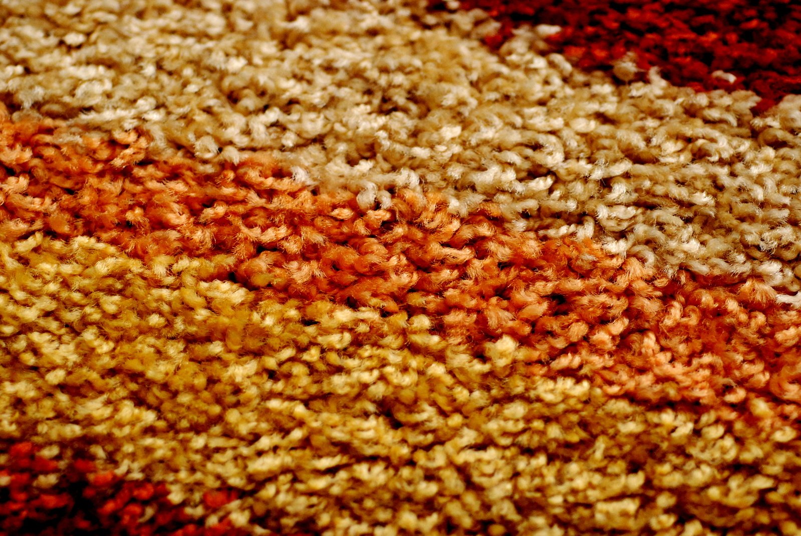 multi colored carpeting area with red, white, and yellow colors