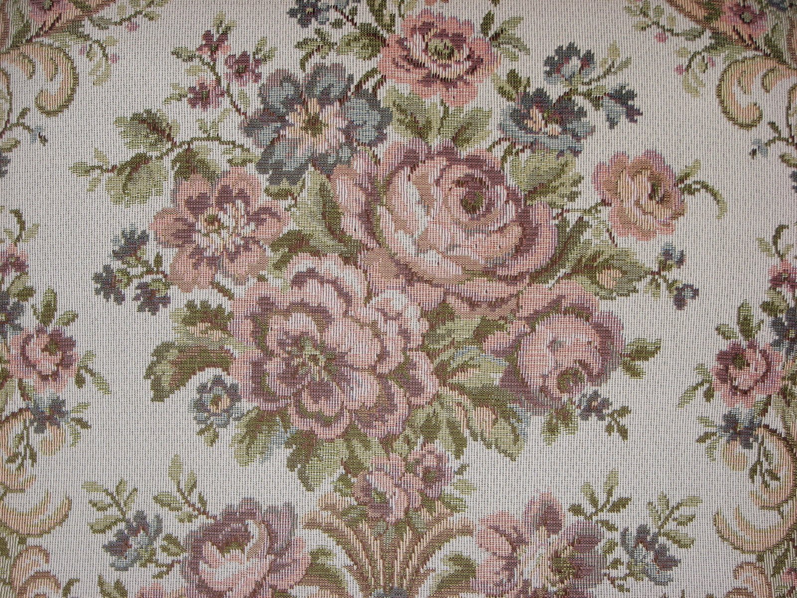 closeup of the top of a white cushion with a floral pattern