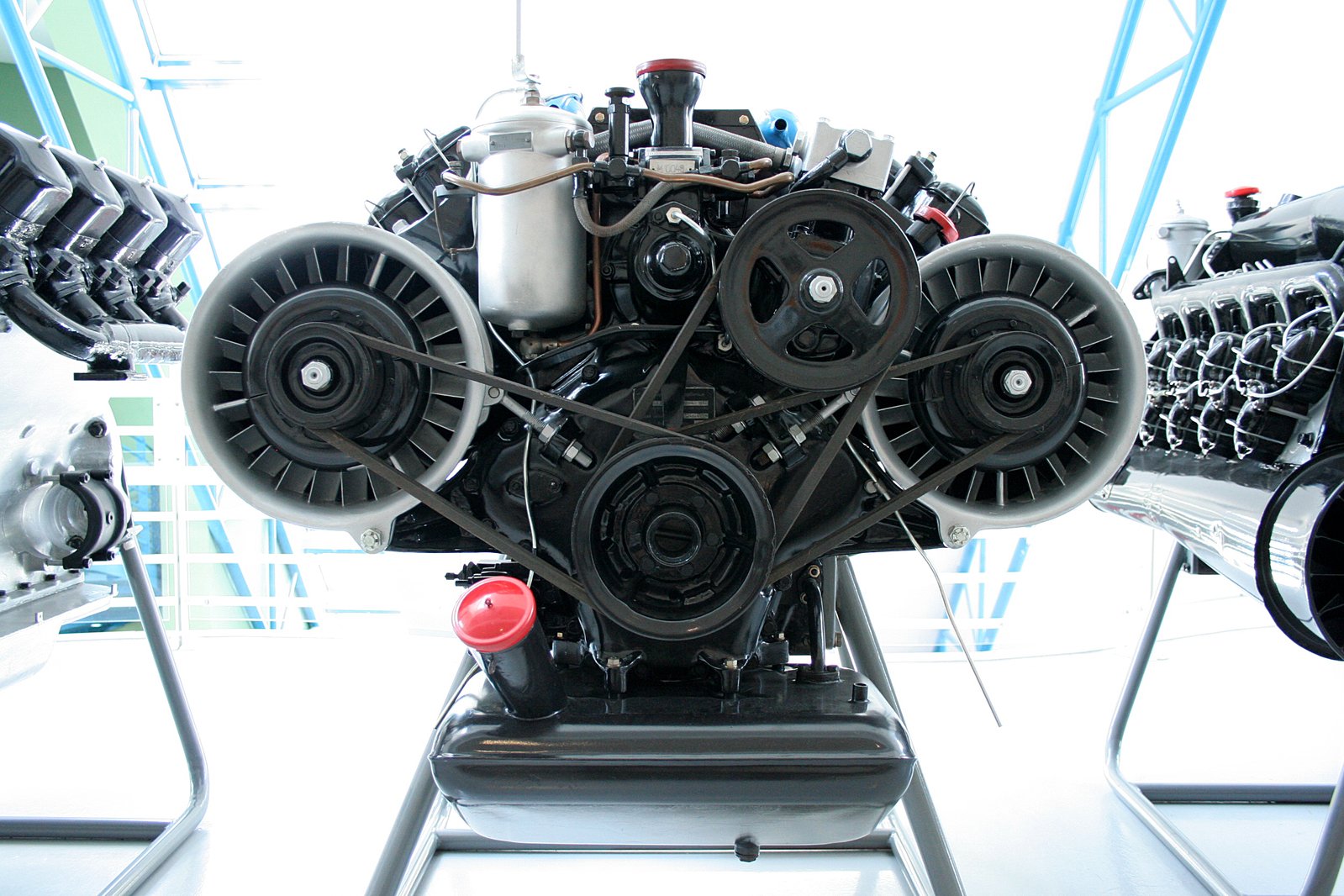 a car engine on a stand with other machinery