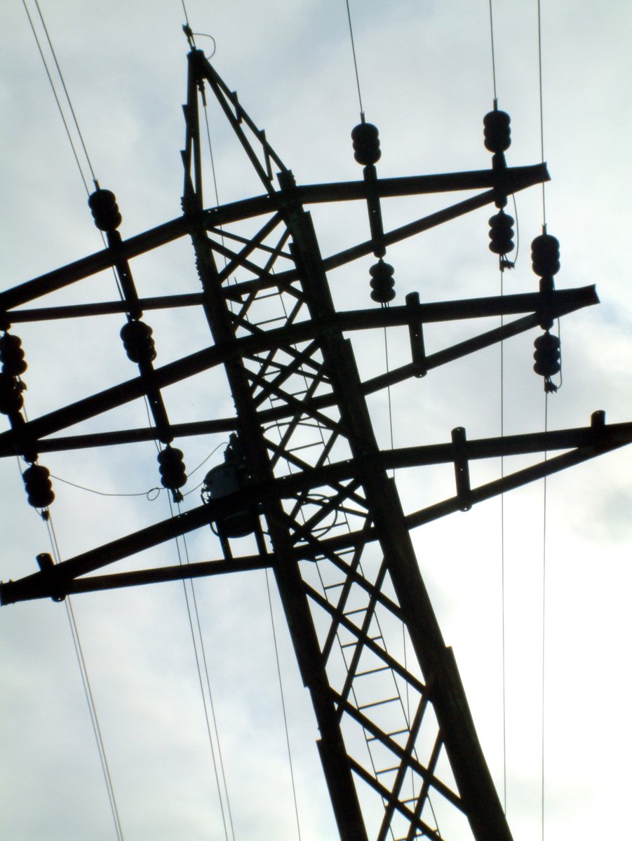 high voltage power lines in a dark area