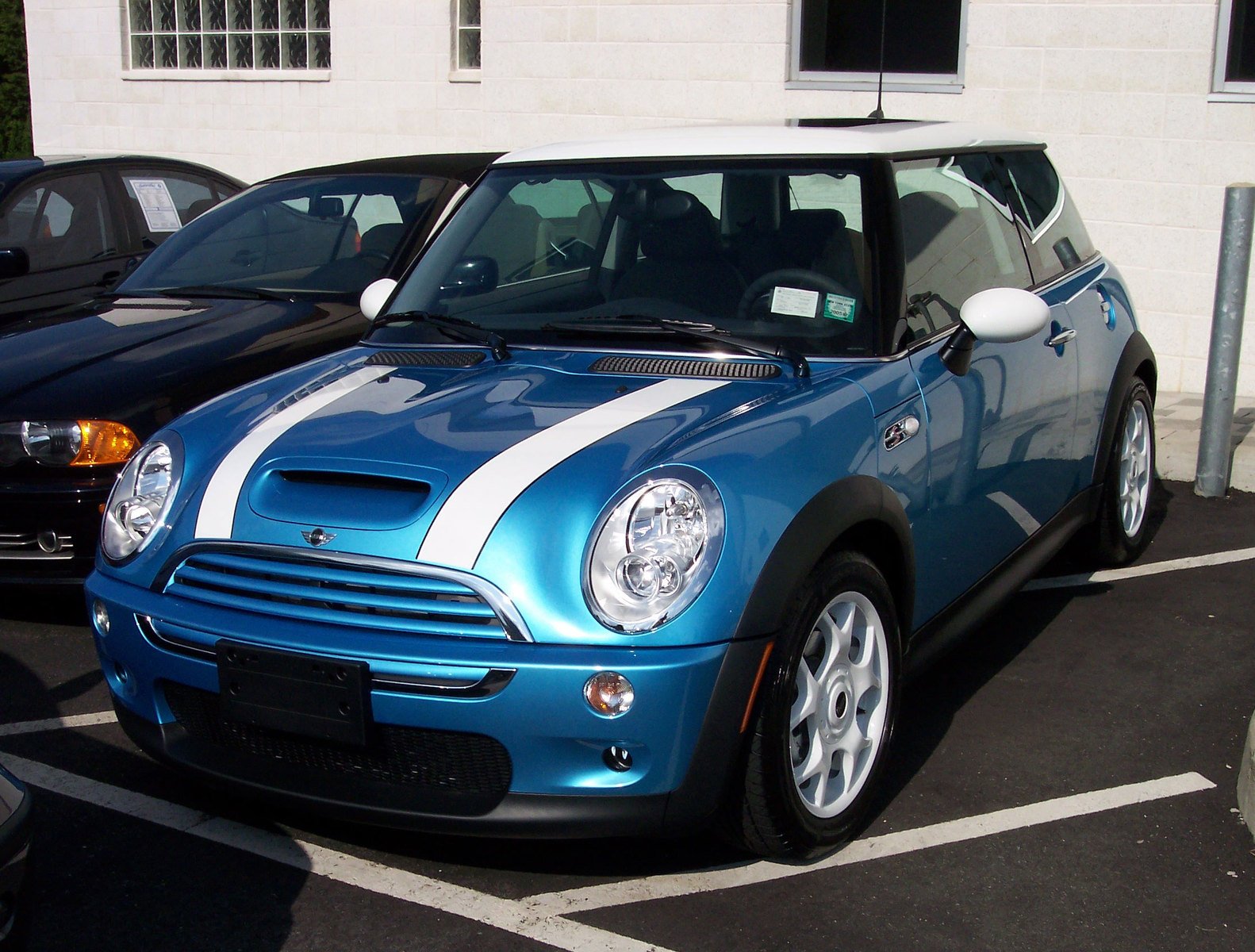 a blue and white striped mini with black doors and headlights