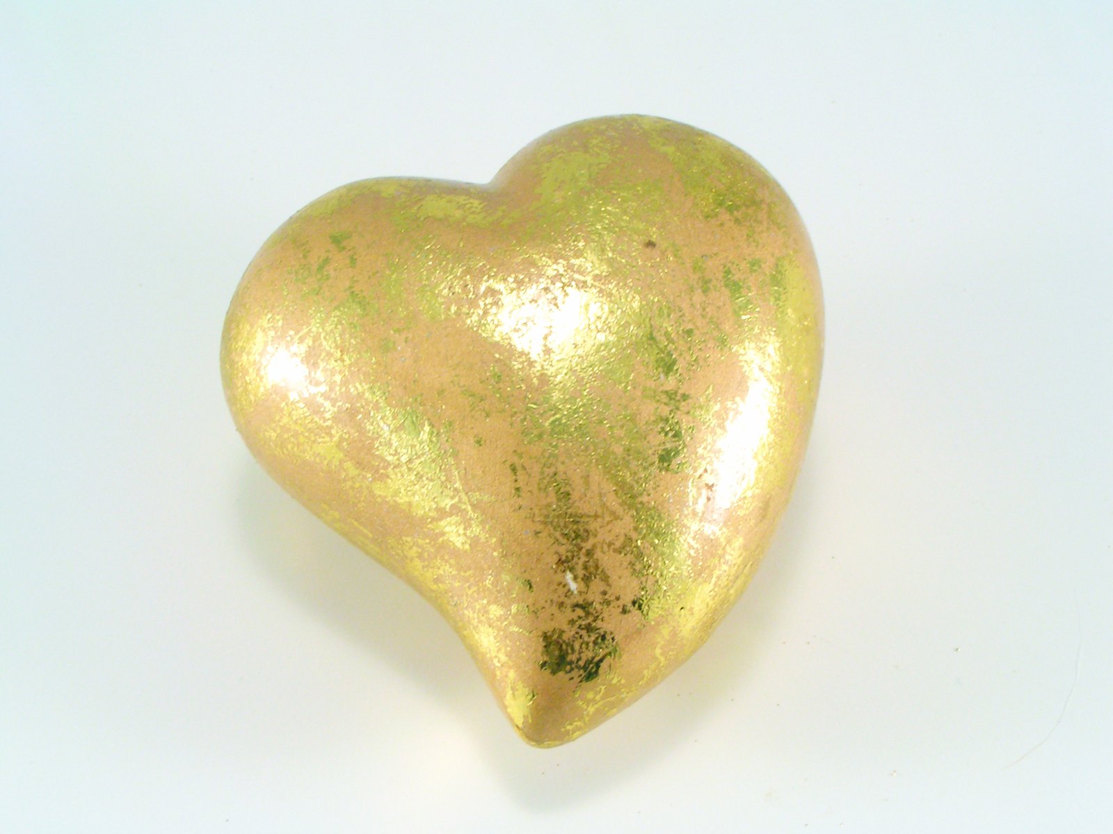 there is a gold heart with some kind of texture