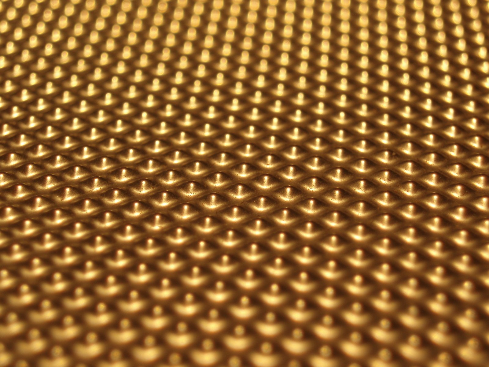 the pattern on the surface of a golden metal plate