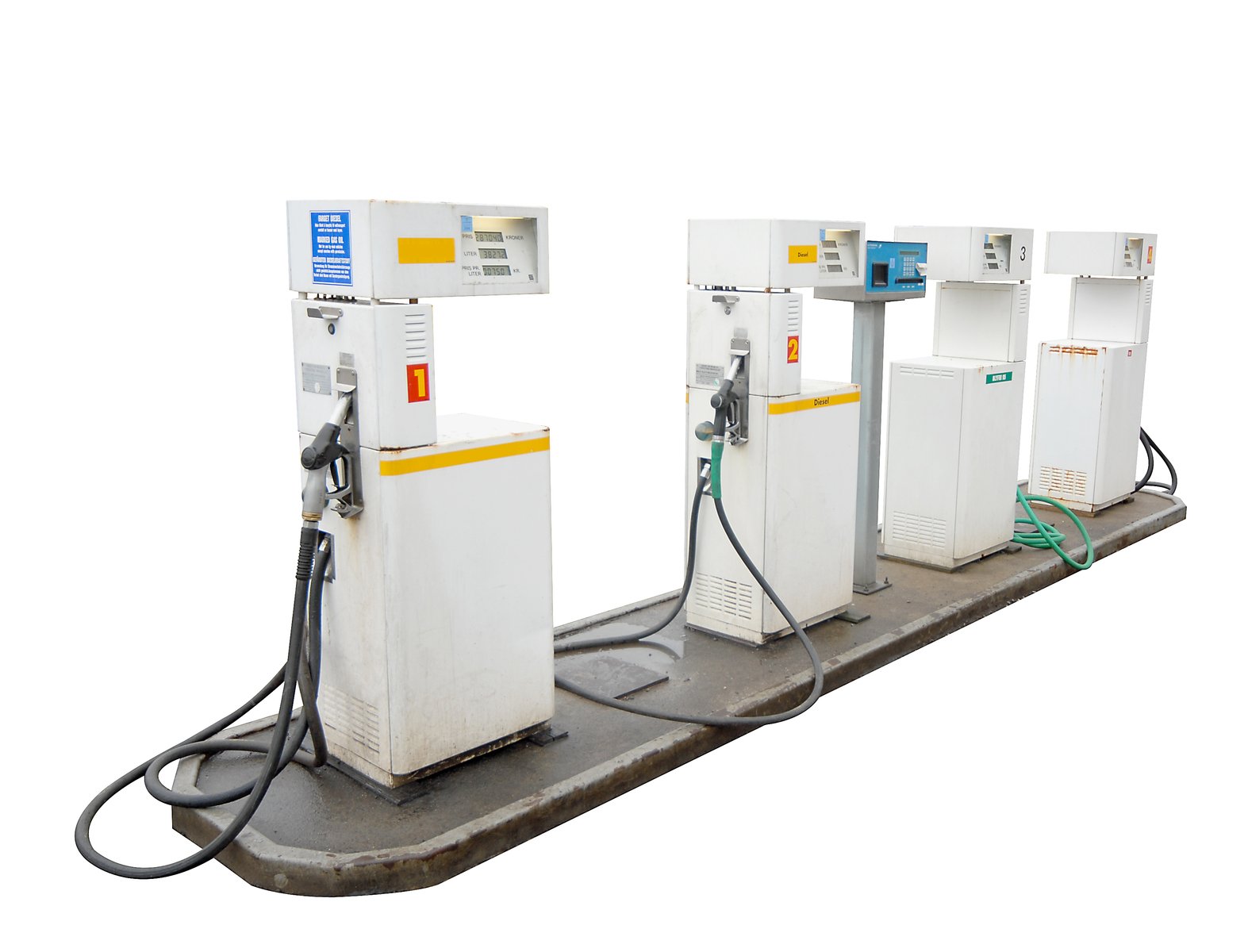 three gas pumps on display on a tray