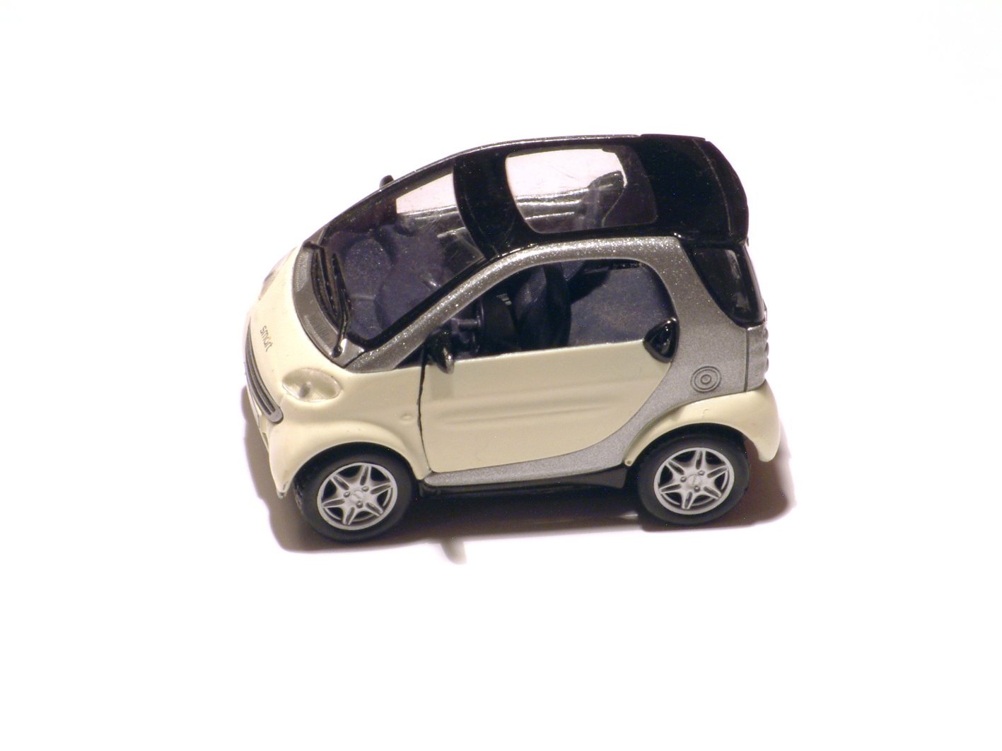 small model car with black and silver top