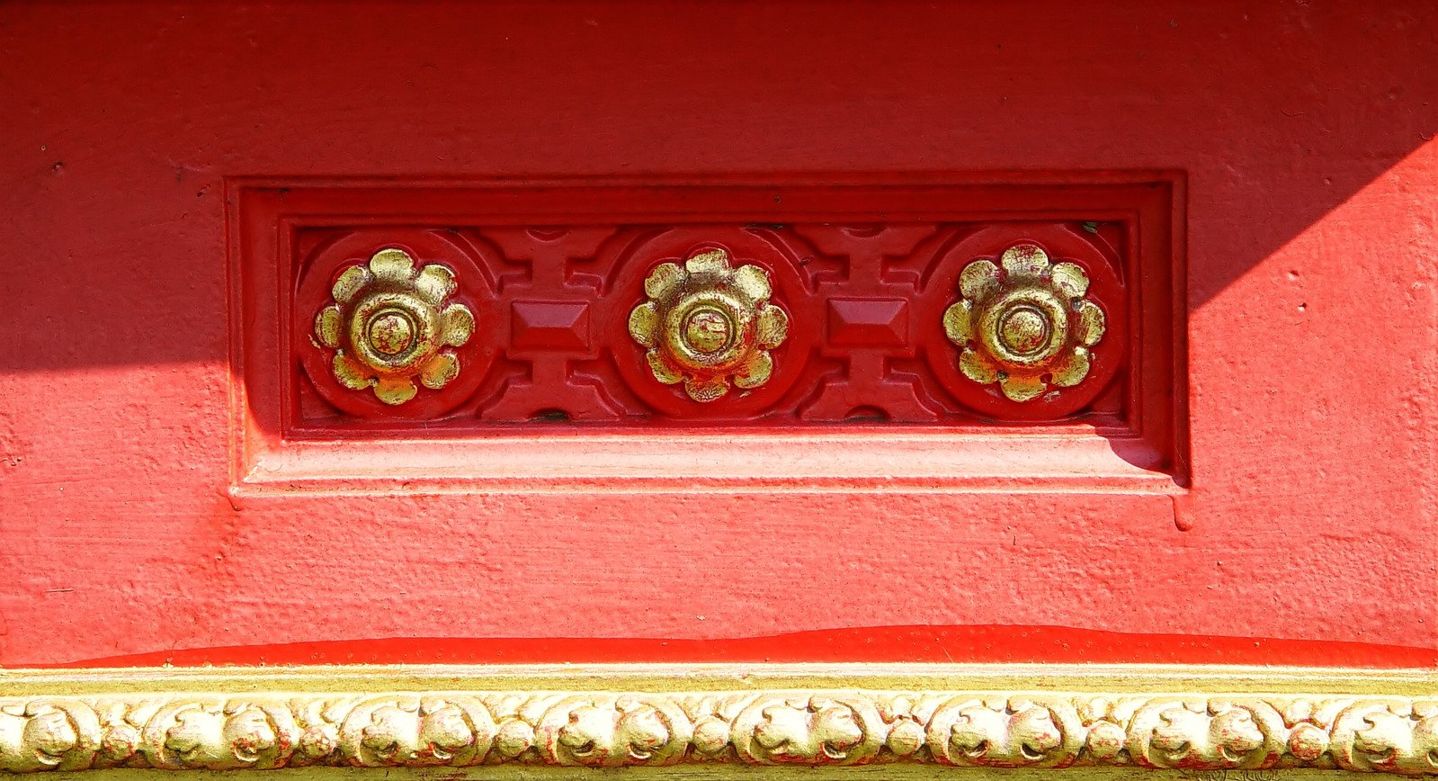 the gold details are in the red building