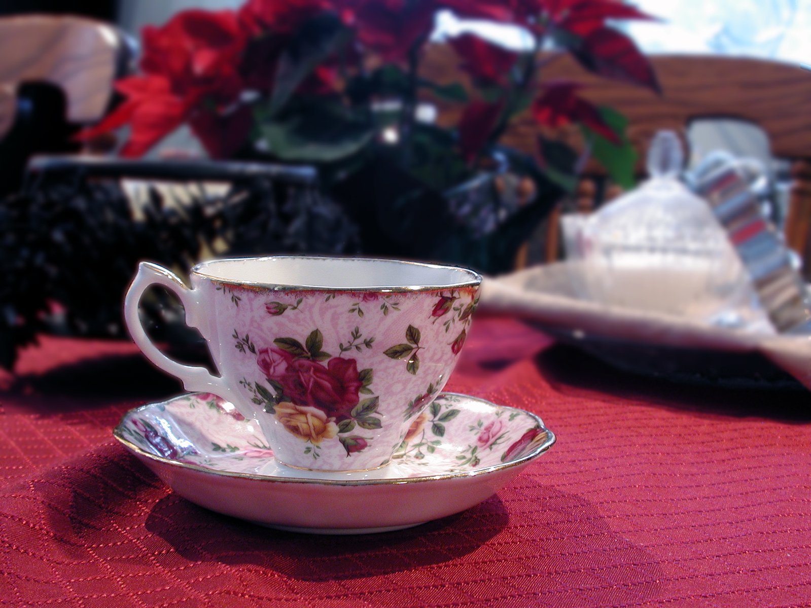 a white plate topped with a pink coffee cup