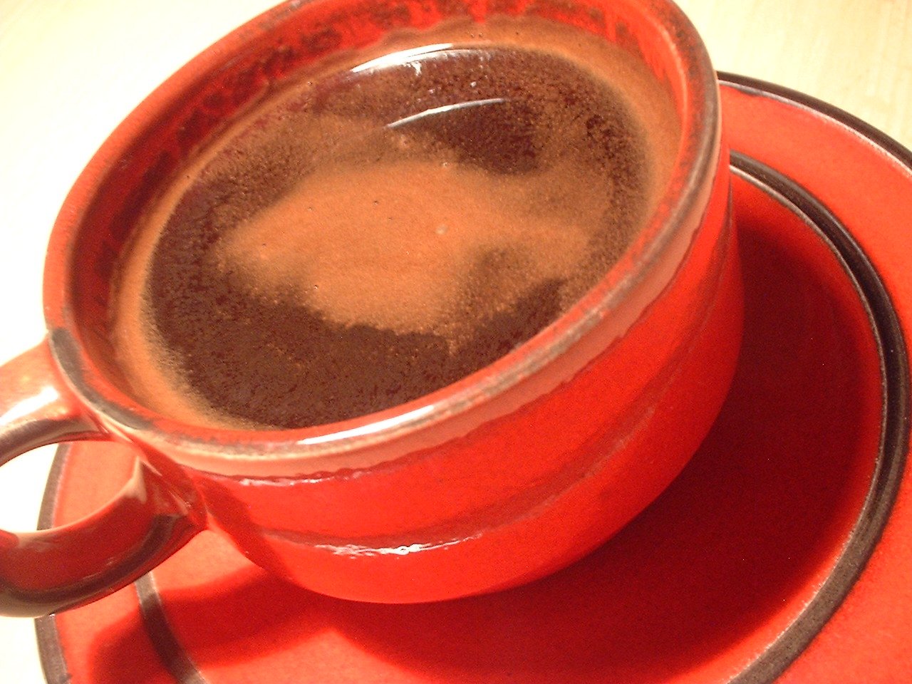 a cup of coffee is shown on a saucer