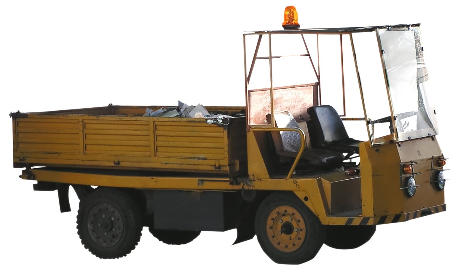 a man is standing in the cab of a large yellow truck