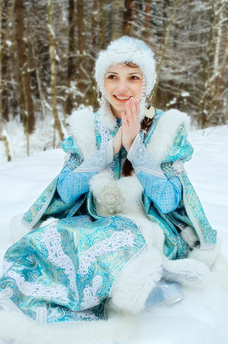 girl in the snow dressed up as a princess