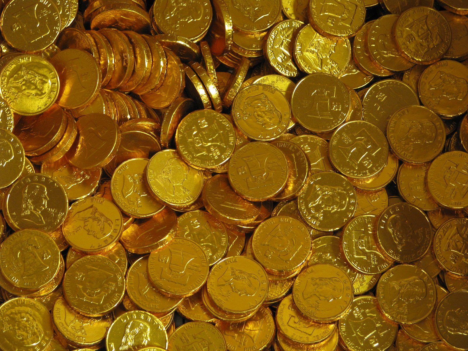 an abundance of gold coins, taken from the side