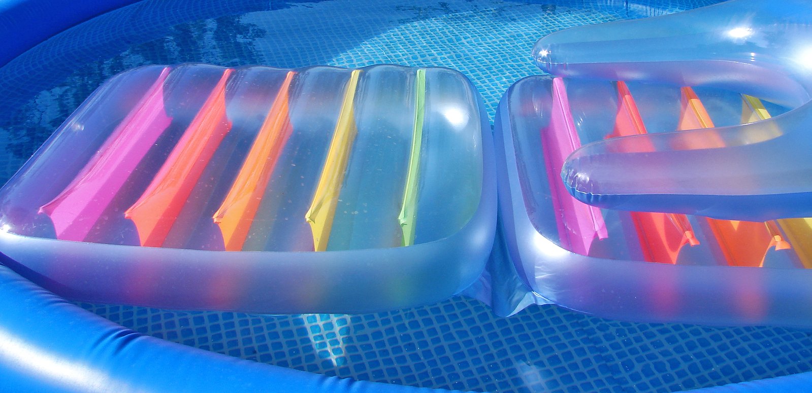 inflatable rafts with water and a raft filled with sticks