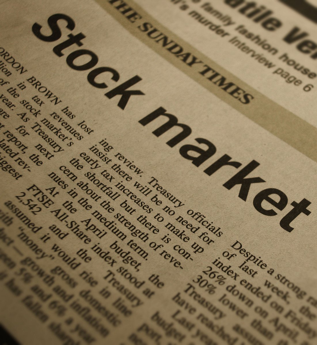 a newspaper page showing a stock market text message