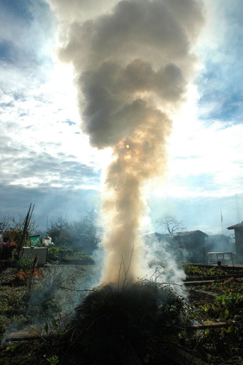 a large white smokestack is coming out of a building