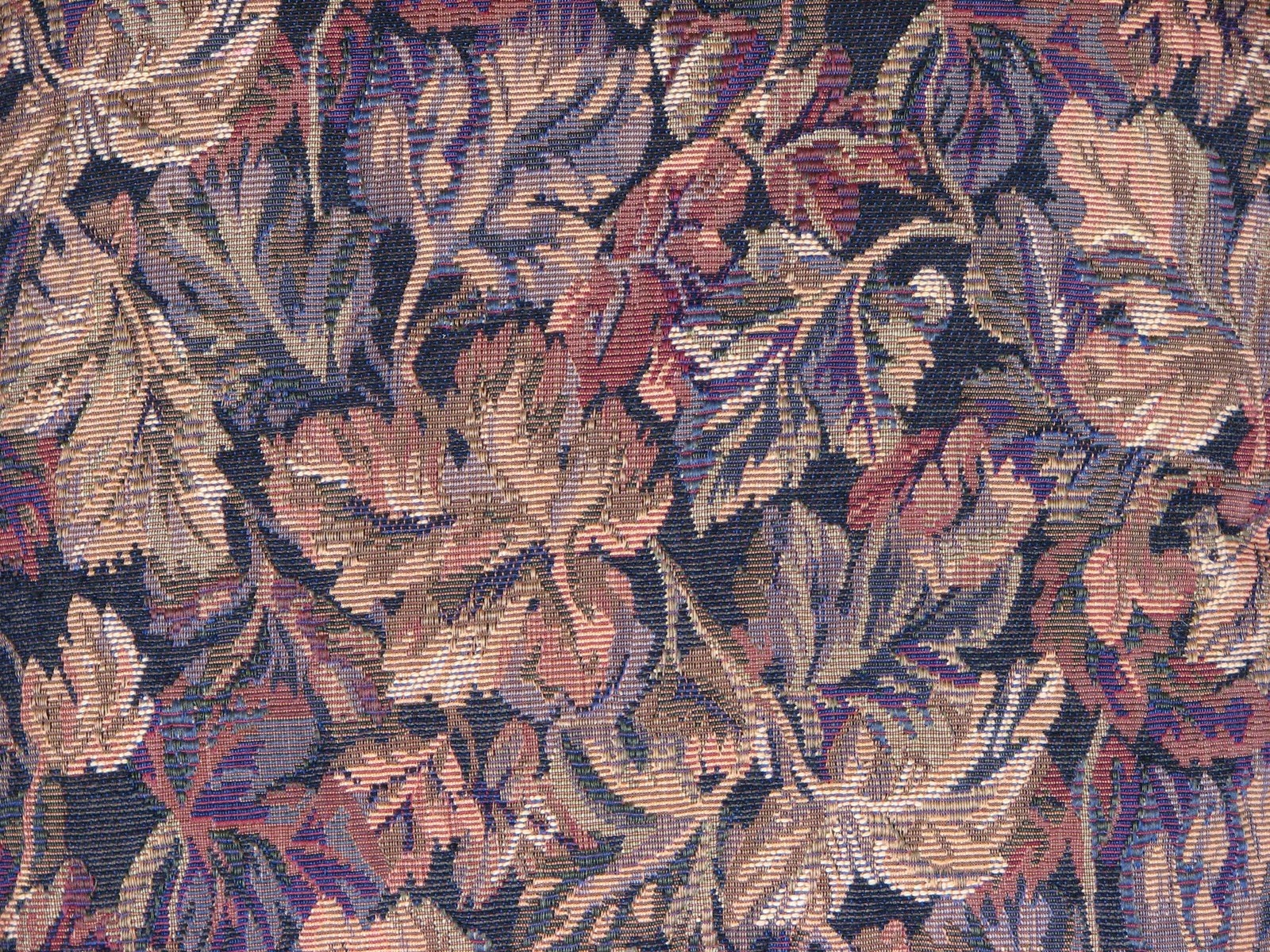 an abstract pattern in pink and purple with lots of leaves