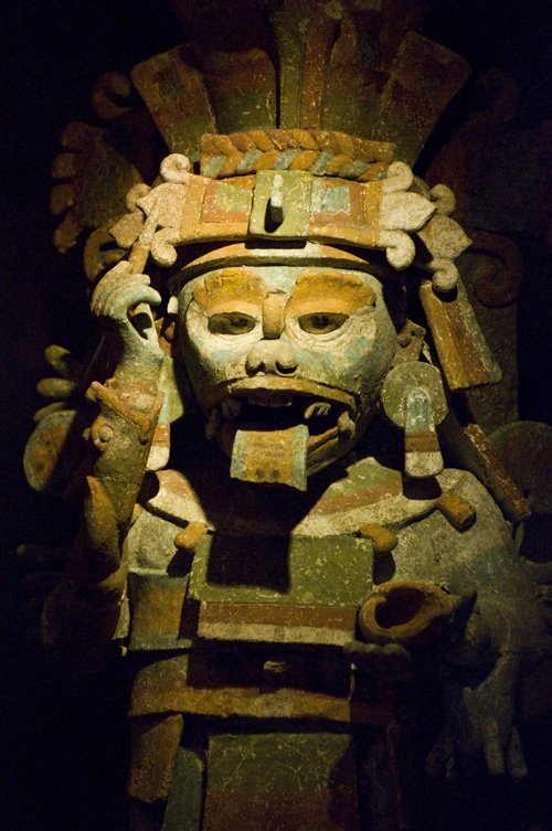 a statue made of clay, including the head and arms of a person