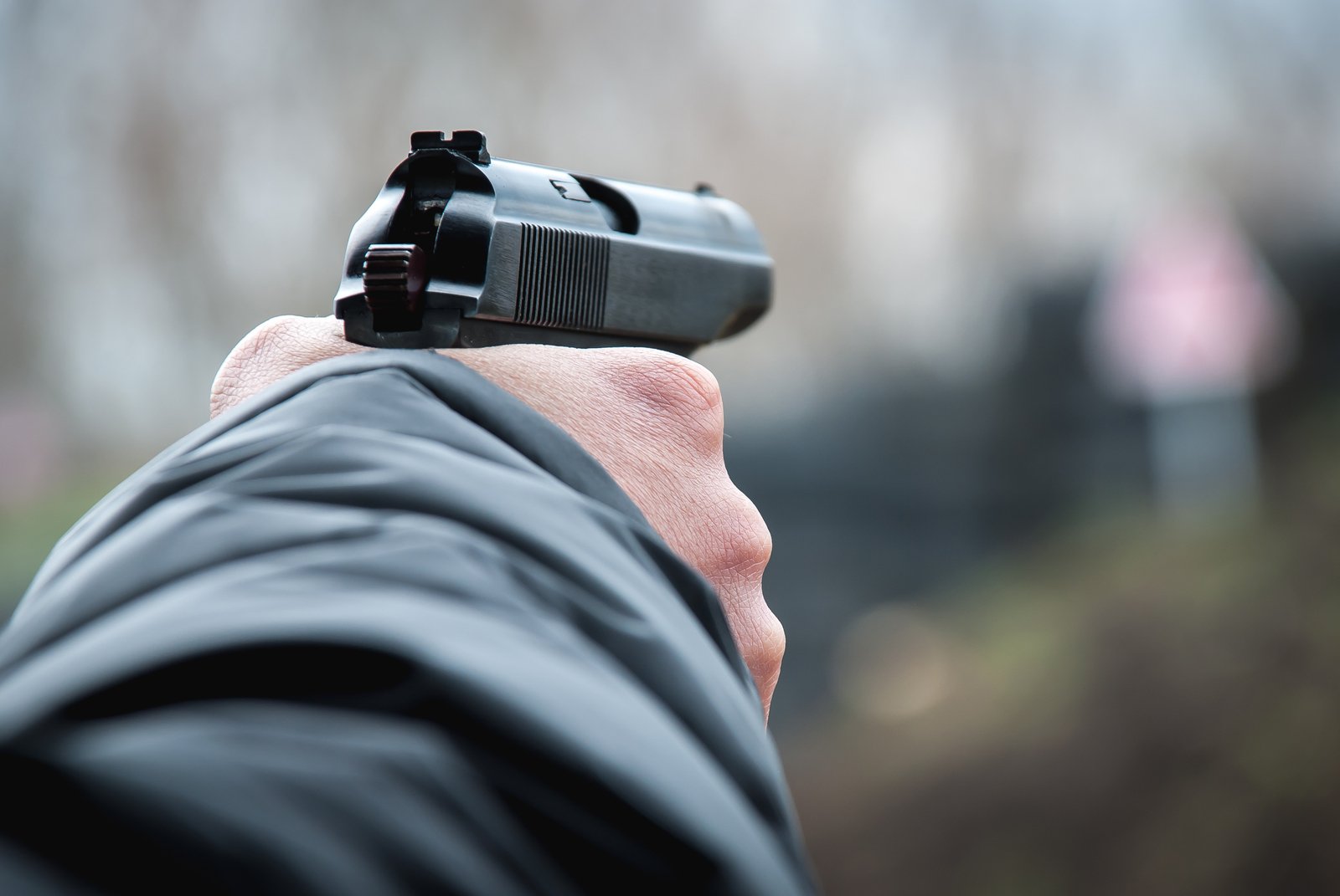 a close - up view of a person with a handgun