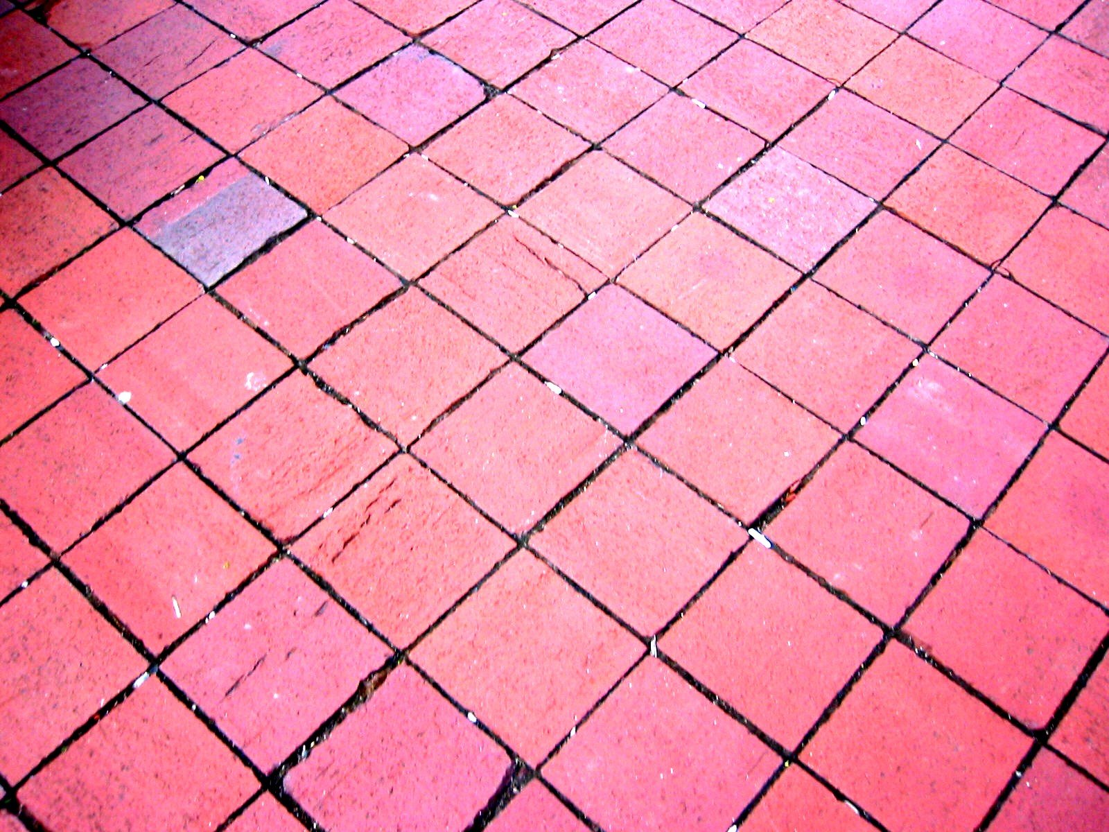 red bricks laid out on the ground in a brick pattern