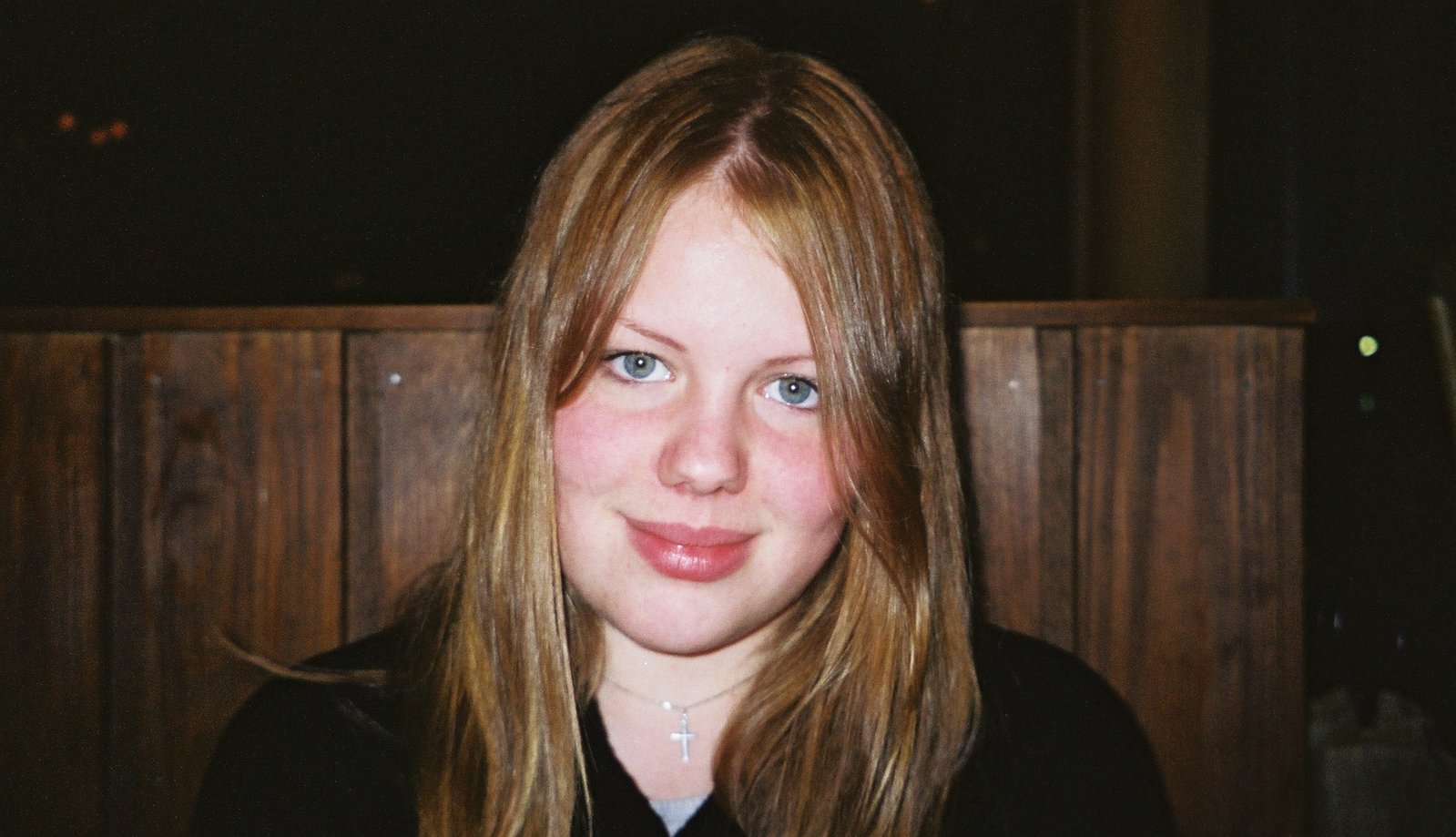 a close up of a woman posing for a picture