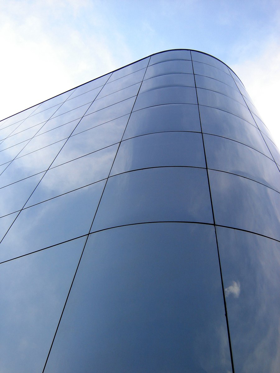 a large office building in the city on a sunny day