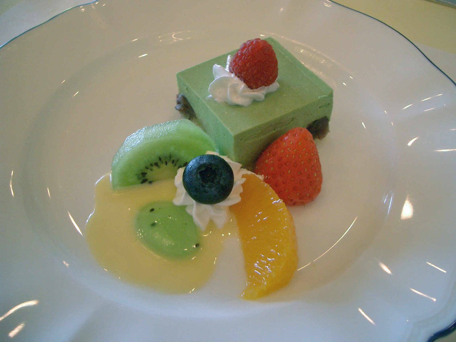 a small dessert is placed on a white plate