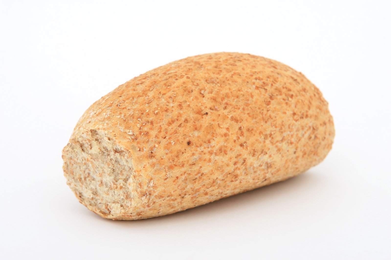 an uncooked piece of bread on a white background