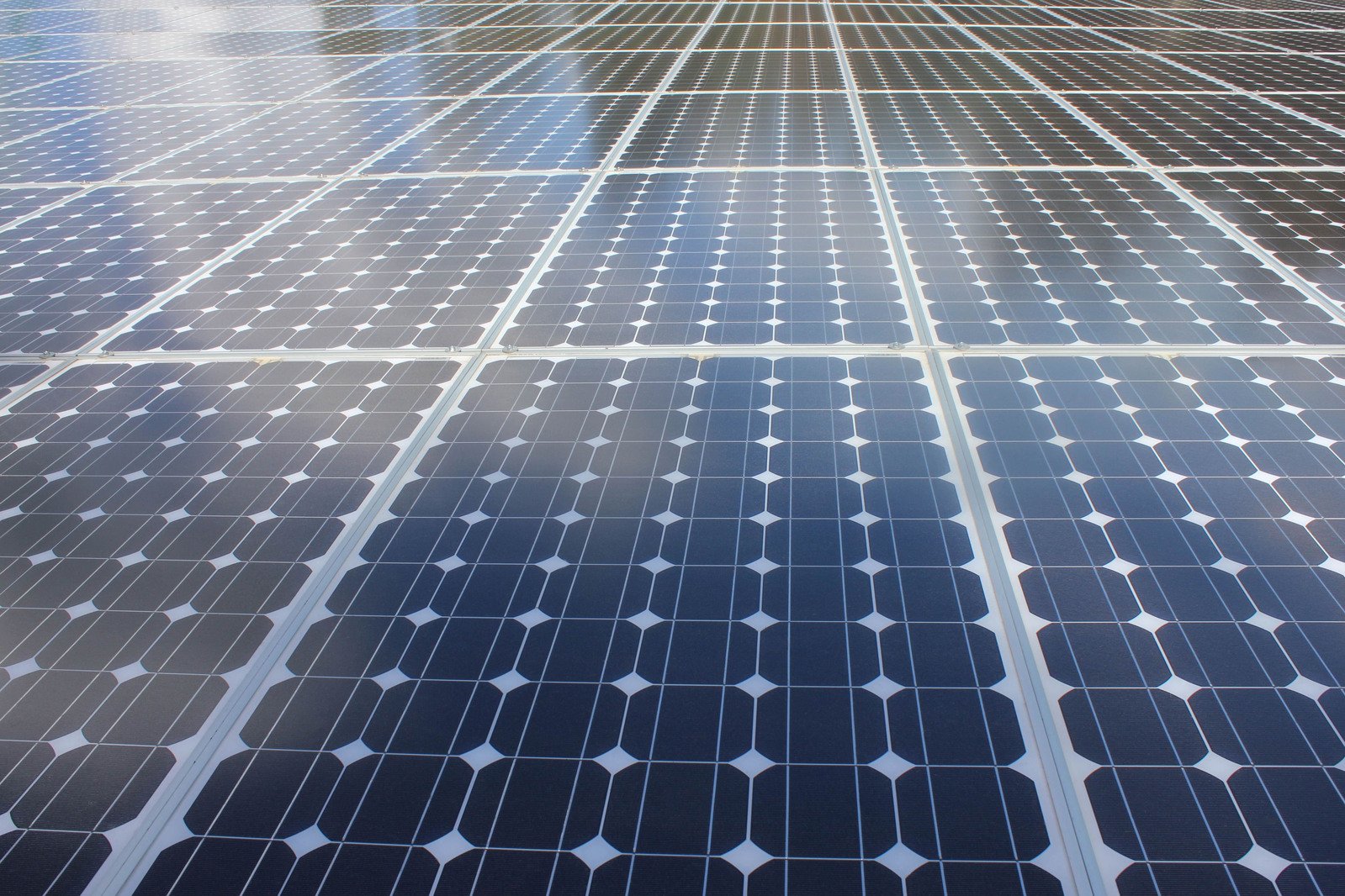 a building with a large amount of solar panels on top of it