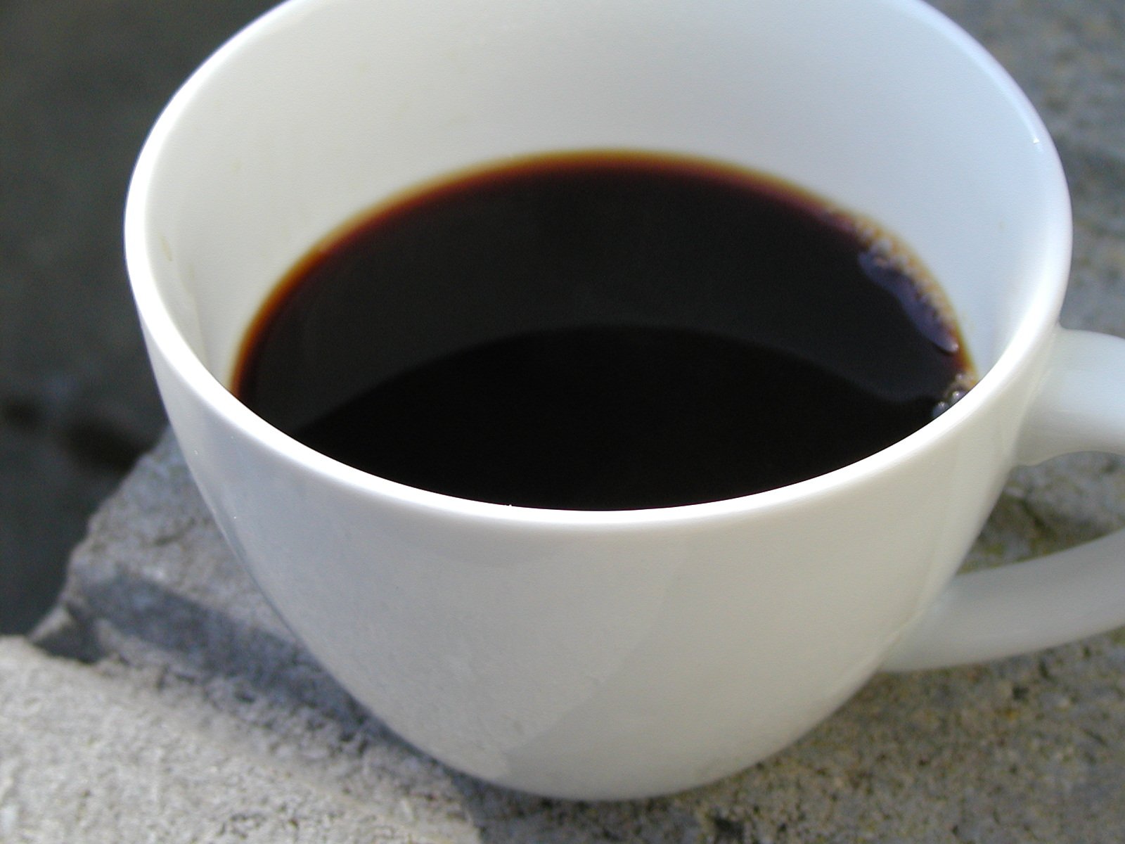 a coffee mug is filled with the liquid