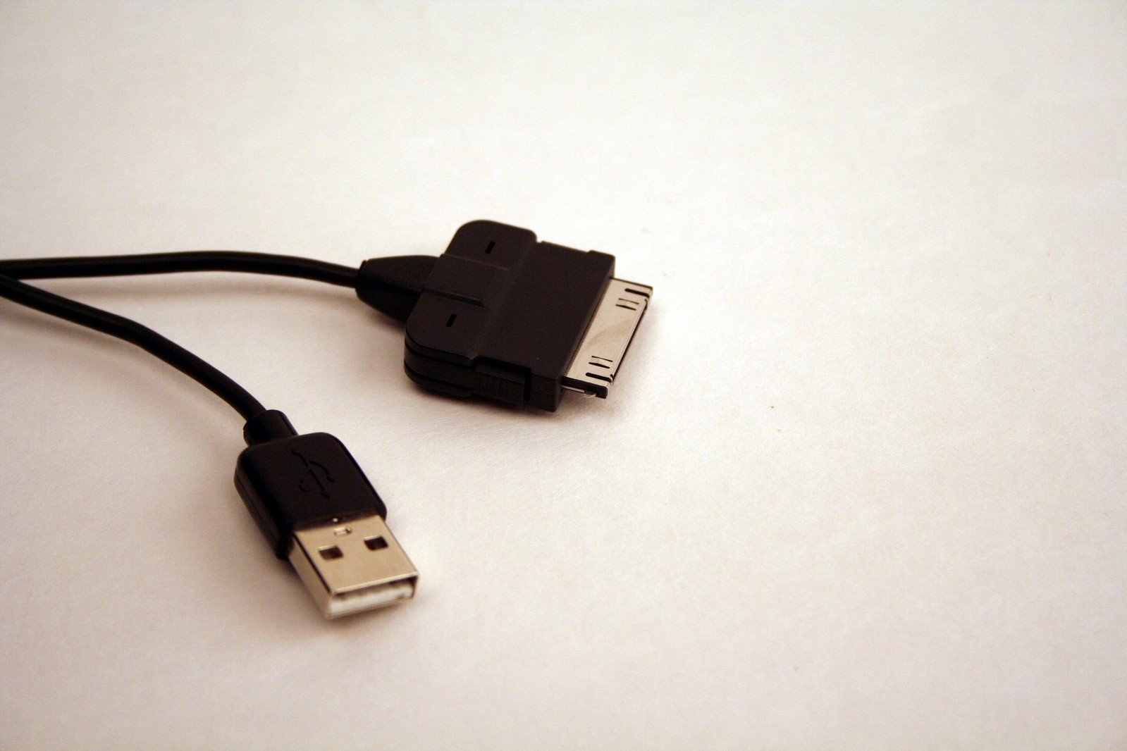 an image of two computer cables connected to a laptop