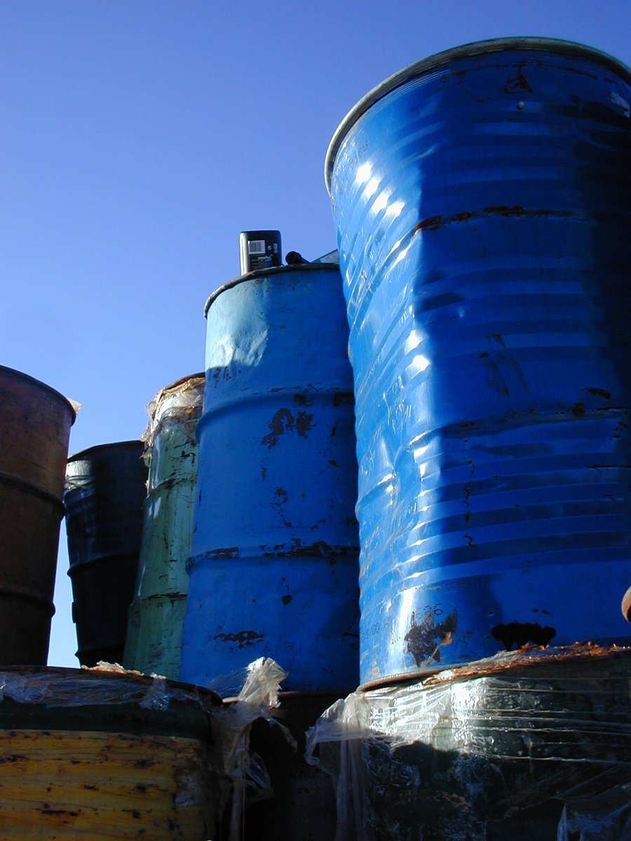 a couple of blue barrels sitting on top of each other
