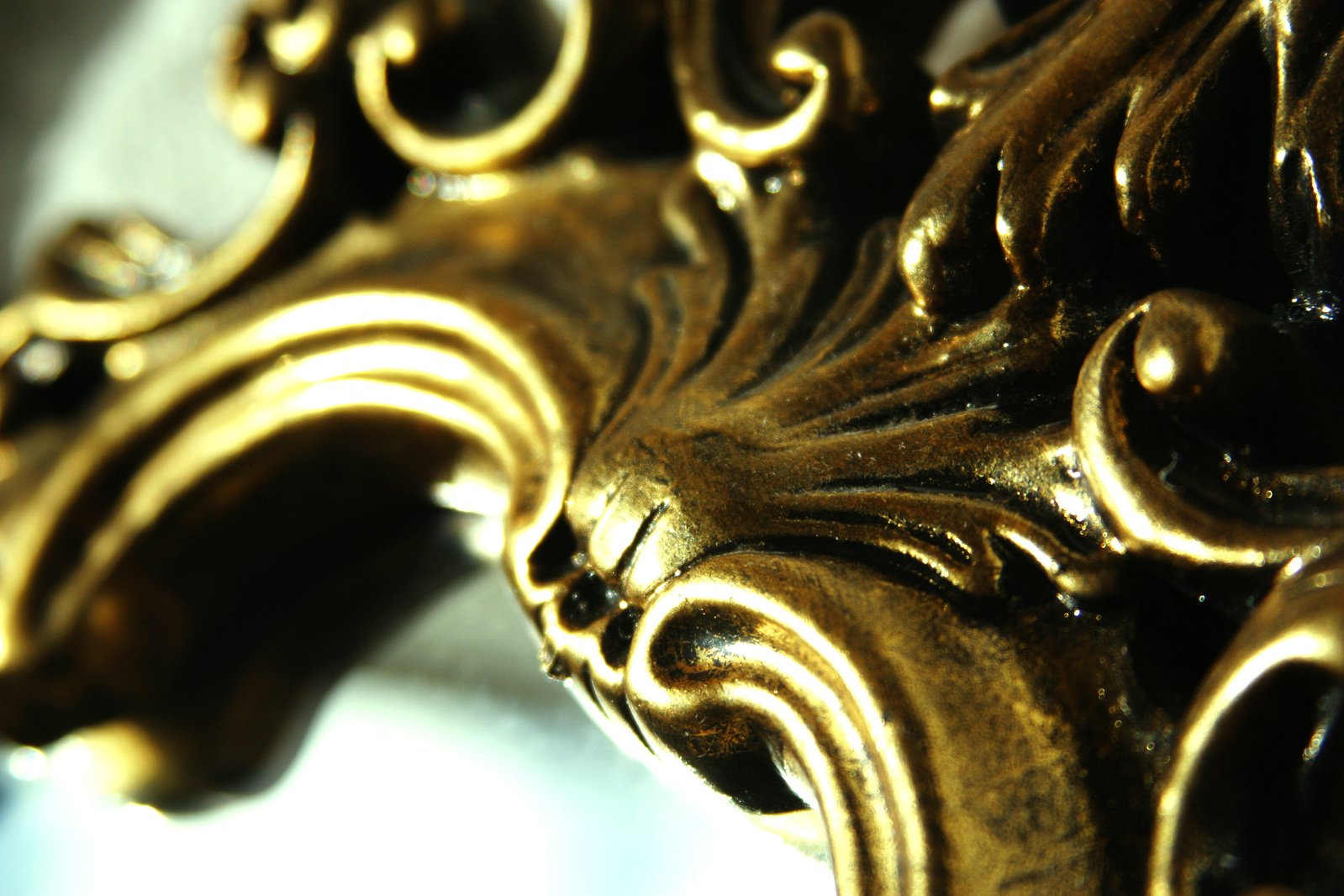 a close - up s of a gold decorative object