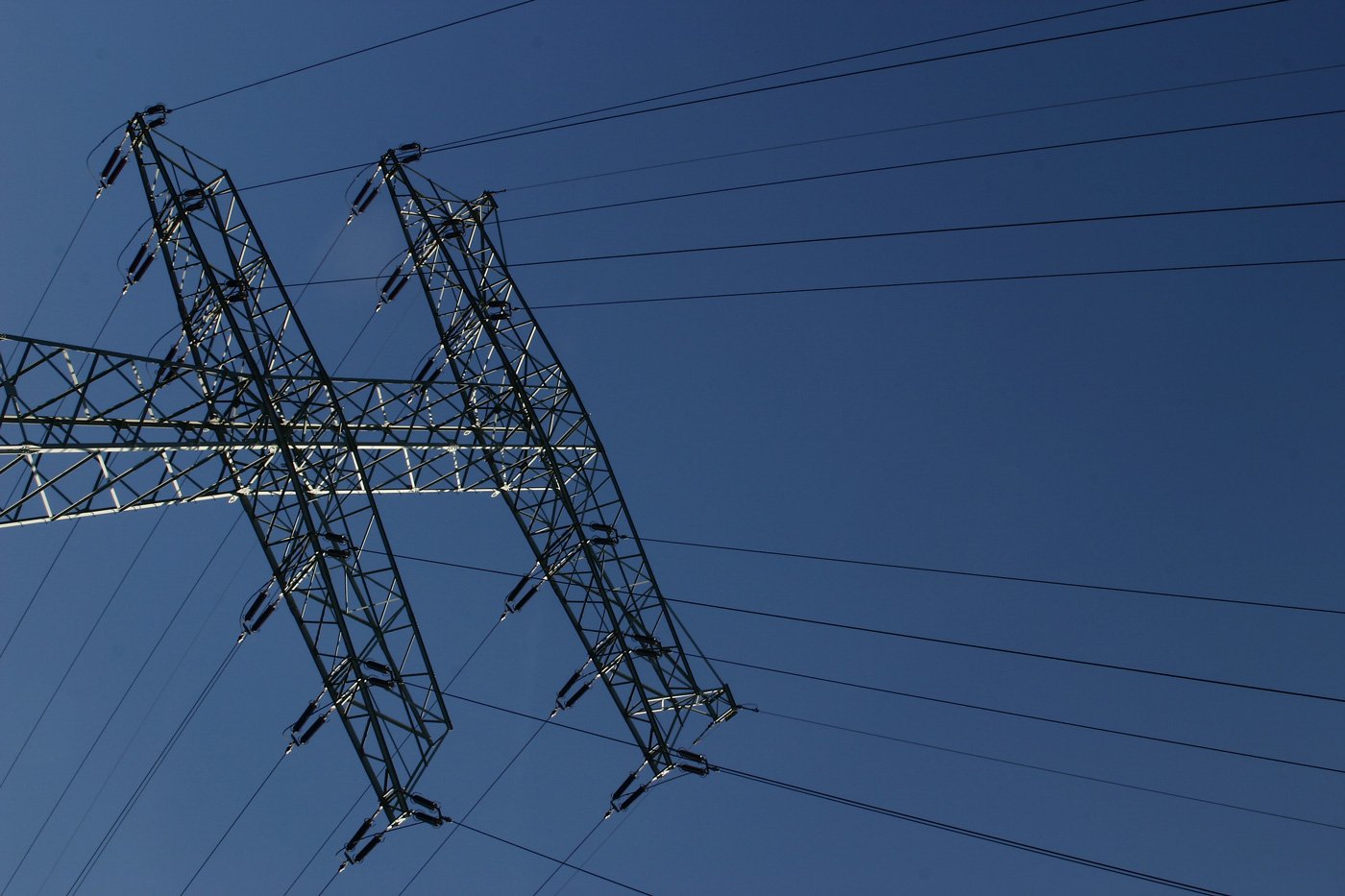 a large tower with lots of electric wires