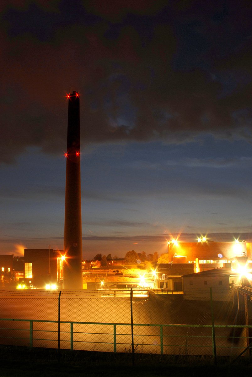 a large tower with lights lit up at night