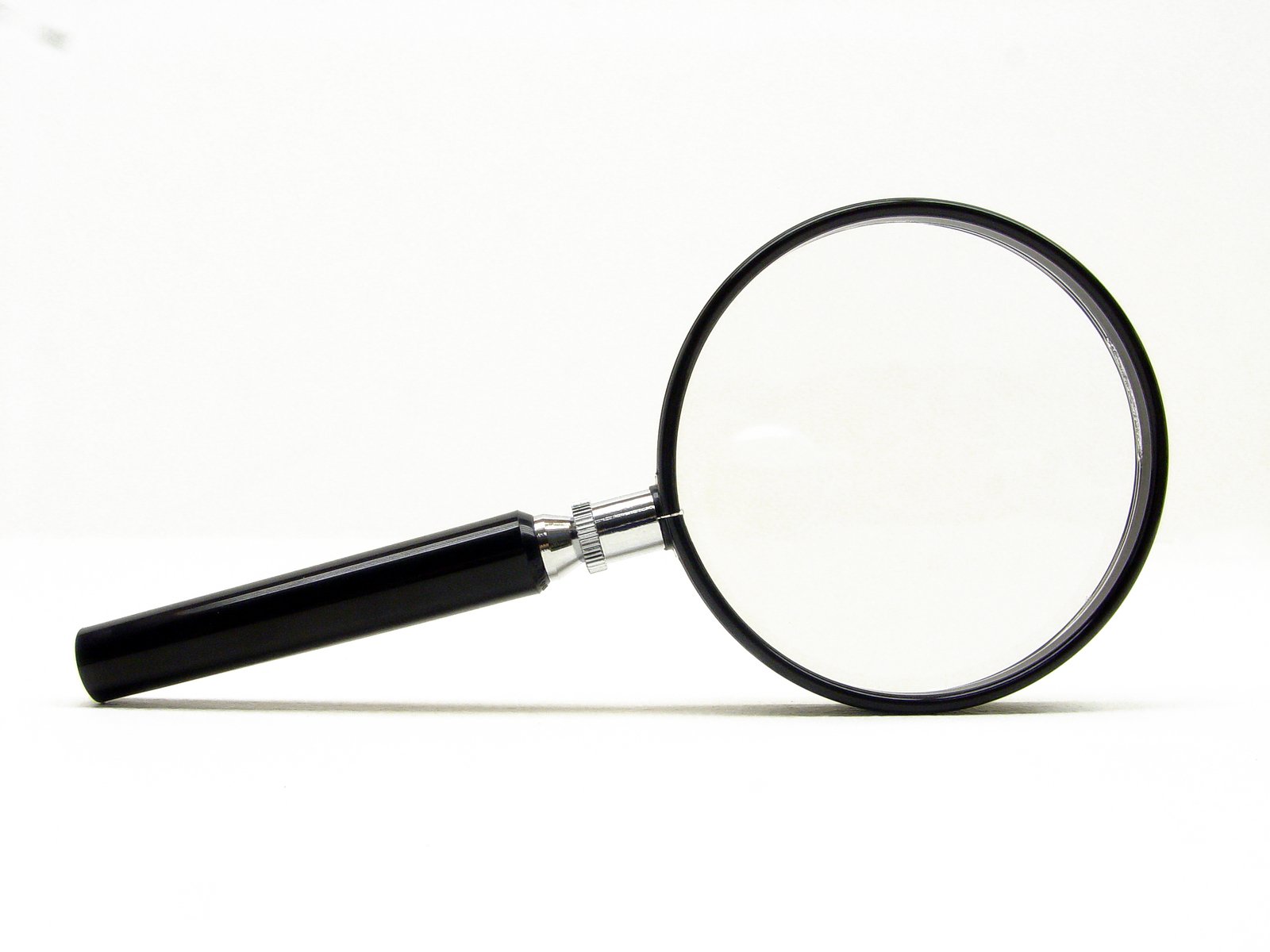 a magnifying glass is shown against a white background