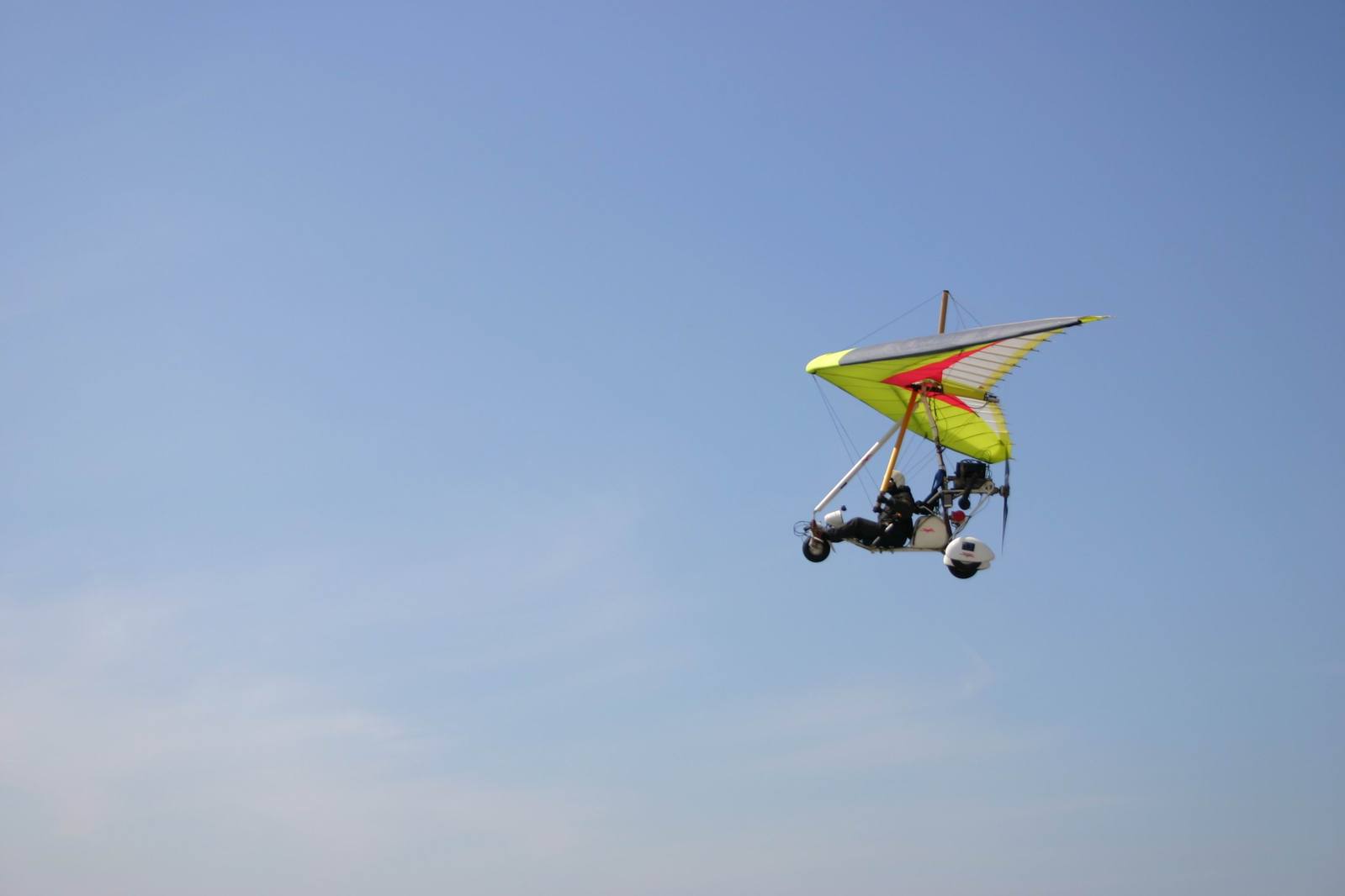 a man flying a kite on the beach